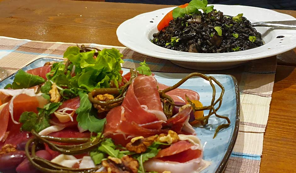 Air-cured ham and Black risotto - Food in Split